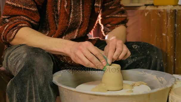 Professional potter shaping mug with special tool in pottery workshop — Stock Video