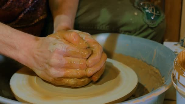 Professional male potter working with clay on potters wheel — Stock Video