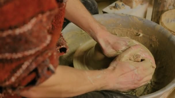 Professional male potter working with clay on potters wheel — Stock Video