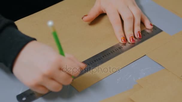 Professional woman decorator, designer working with kraft paper — Stock Video