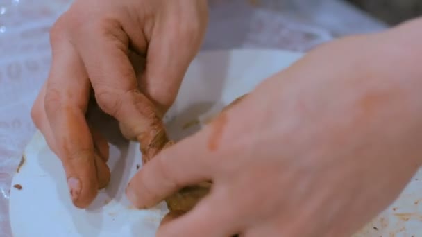 3 shots. Professional male potter making mug in pottery workshop — Stock Video