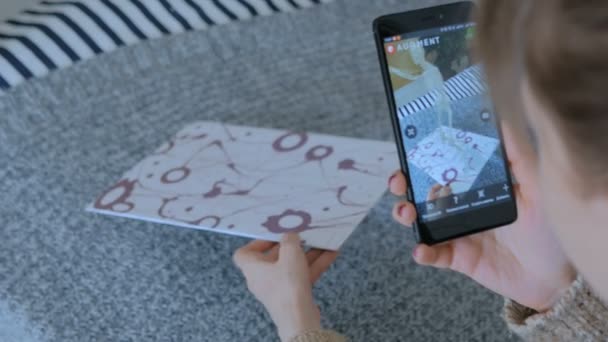 Woman using smartphone with augmented reality app — Stock Video