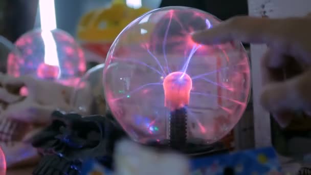 Woman hand touching plasma ball — Stock Video