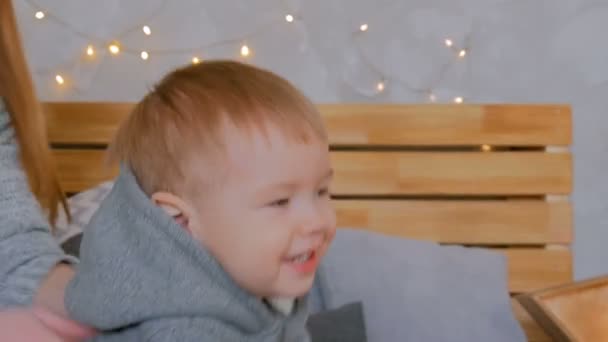 Happy young mother and her baby son playing togerher — Stock Video