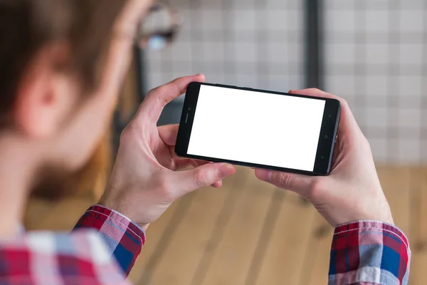 Mockup image - man holding black smartphone with white blank screen