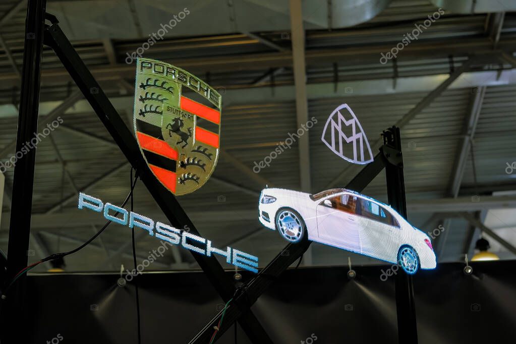 MOSCOW, RUSSIA - JUNE 05, 2019: Sci-fi Expo. 3D led holo fan advertising projector device displays floating hologram projections at technology exhibition. Future, consumer society, digital concept