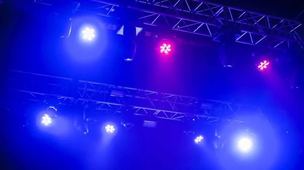 Colorful bright concert lighting equipment for stage at nightclub