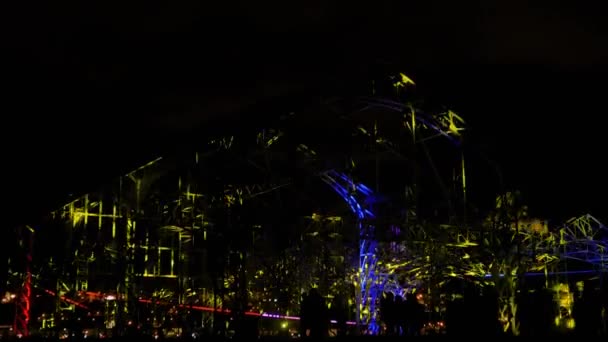 Video mapping show projected on metal construction of warehouse on street — Stock Video