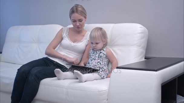 Mother and baby using digital tablet — Stock Video