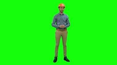 İnşaat işçisi faktörler parmaklarını Chroma anahtar yeşil ekranda başarı için kaydetme.