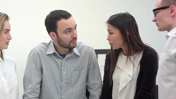 Female worker complaining to her office colleagues about work load — Stock Video