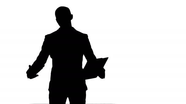 Silhouette Smiling young man making business presentation — Stock Video