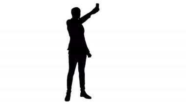 Siluet genç adam telefonda selfies alarak takım
