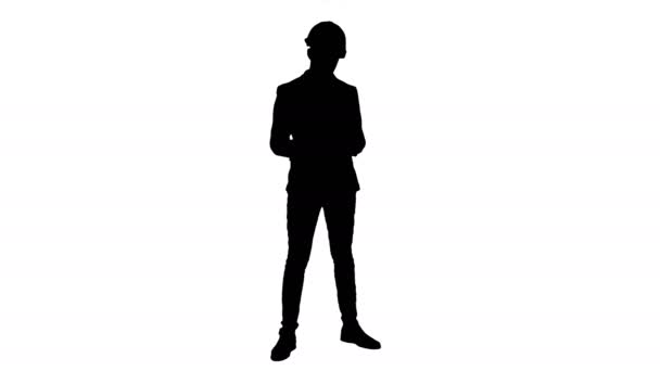 Silhouette Young manager en el casco sosteniendo la tableta y mostrando el pulgar hacia arriba — Vídeo de stock