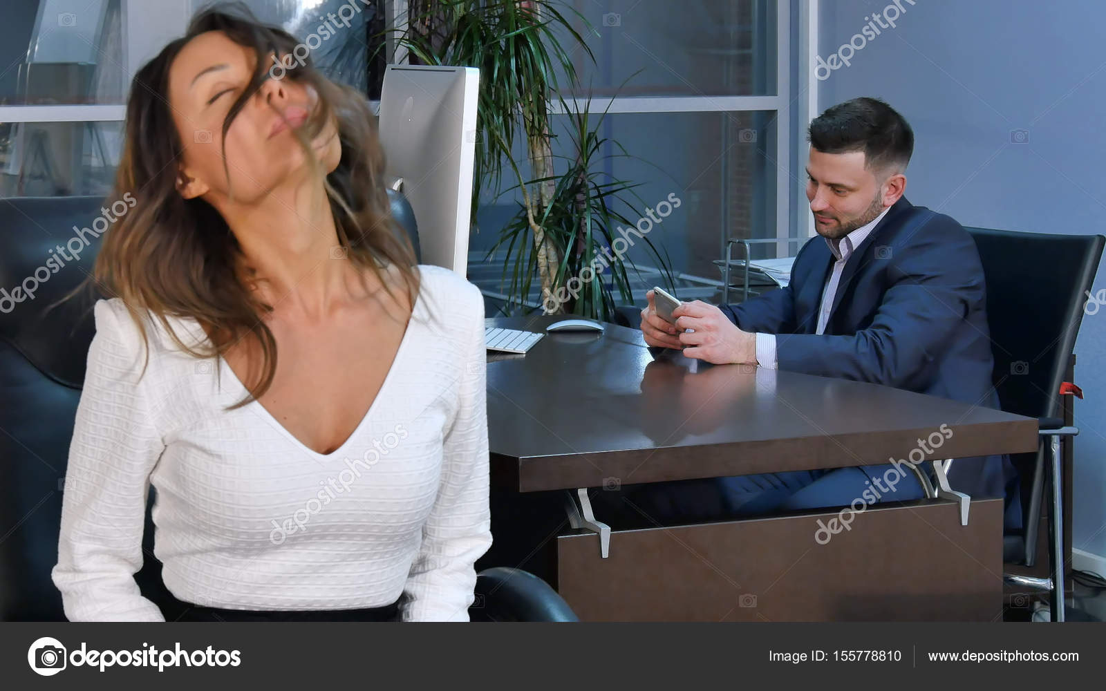 Young Healty Office Woman Doing Fitness Exercise At Workplace