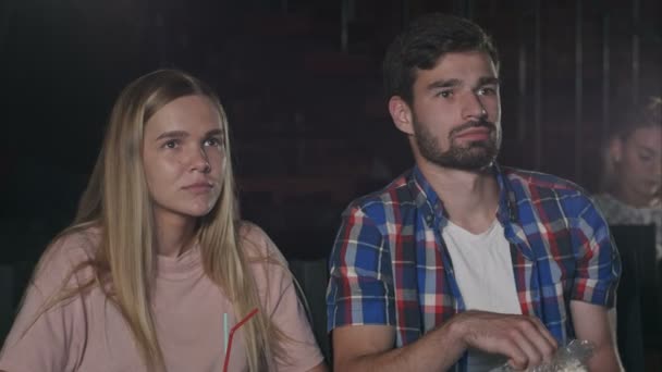 Young people watch movies carefully in cinema — Stock Video