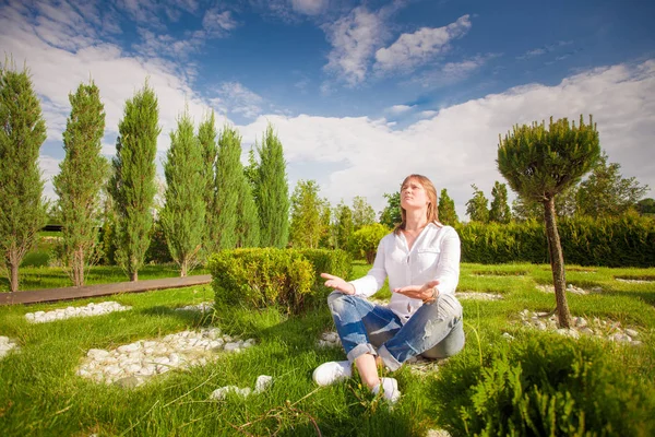 Cheerful girl in the park resting in trousers — Stock Photo, Image