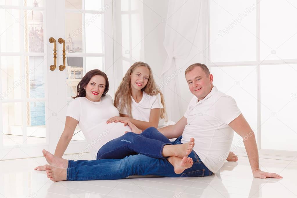 family with a daughter waiting for a newborn