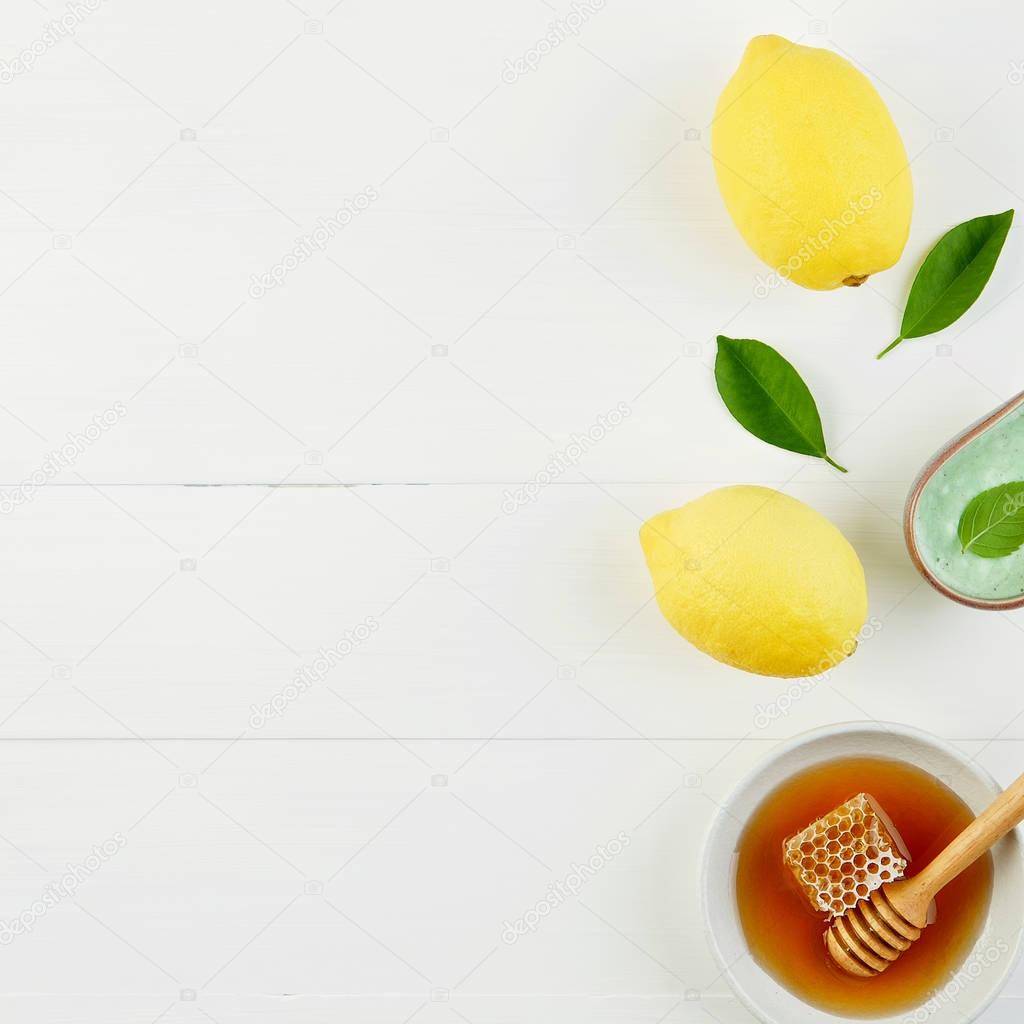 Homemade lemon salt bath and fresh honey in the plate with honey