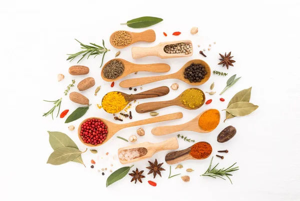 Various herbs and spices on wooden spoons. thyme, cinnamon, anis — Stock Photo, Image