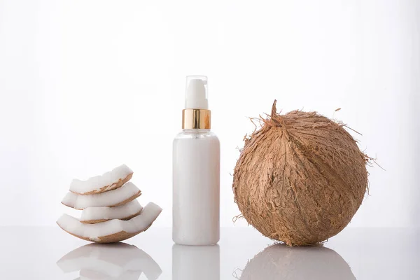 High key homemade cosmetic coconut products with coconut on whit