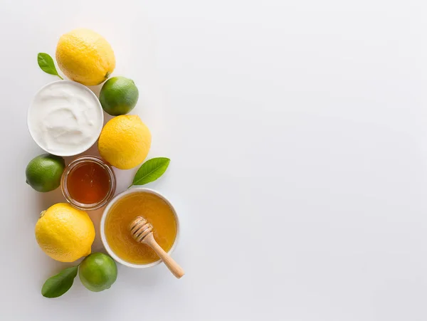 Homemade yogurt with honey and lemon on white background from to — Stock Photo, Image