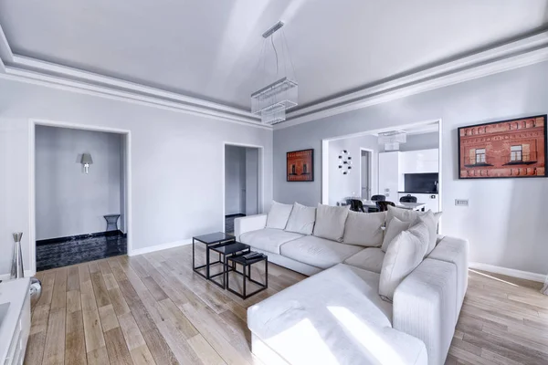 The interior of the spacious apartment in white tones.