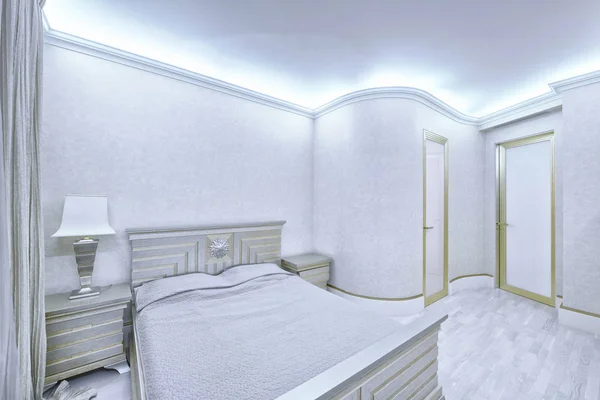 Russia, Moscow - modern designer renovation in a luxury building. Stylish bedroom interior with double bed.