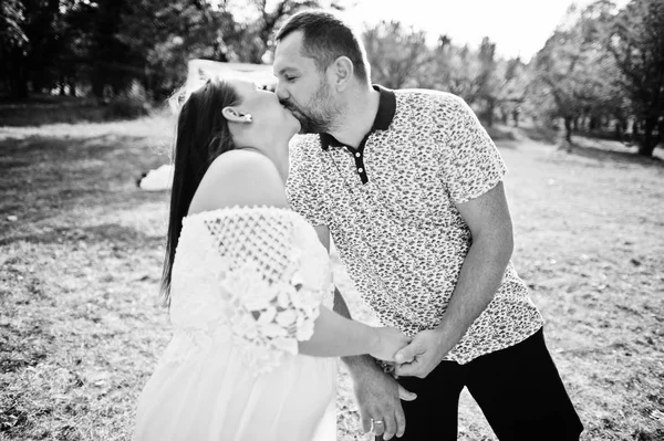 Happy pregnant couple stay hugging and loving near decor arch at — Stock Photo, Image