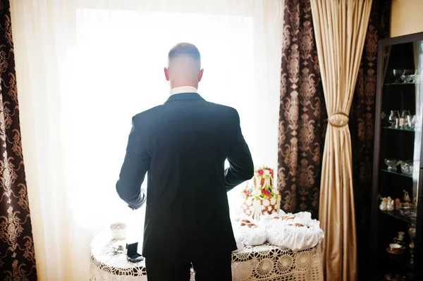 Man wearing luxury jacket background backlight of window. Gather — Stock Photo, Image