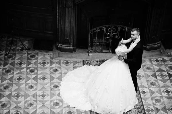 Royal wedding couple background big stone fireplace at the palac