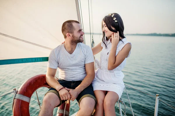 Young beautiful married couple in love at the yacht on vacation. — Stock Photo, Image