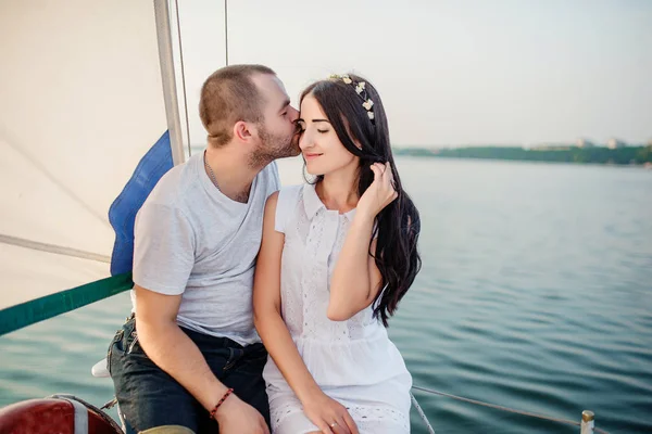 Young beautiful married couple in love at the yacht on vacation. — Stock Photo, Image