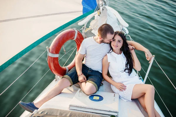 Young beautiful married couple in love at the yacht on vacation. — Stock Photo, Image