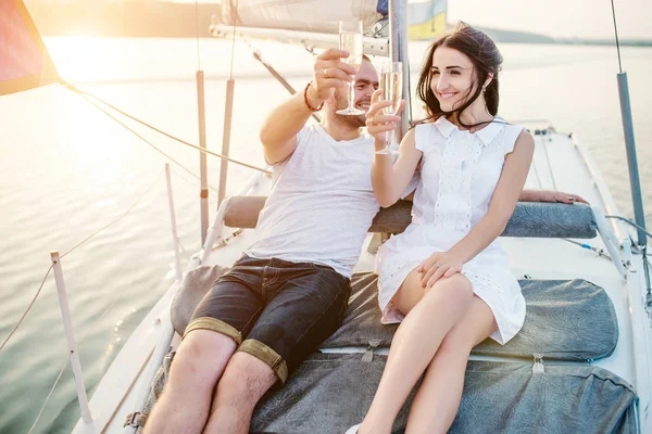 Young beautiful married couple in love at the yacht on vacation. — Stock Photo, Image