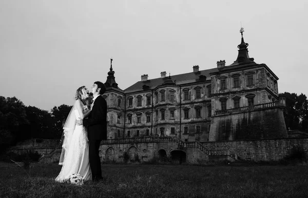 Wedding couple at night background old scary vintage castle. Bla