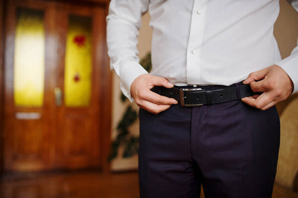 Man wear belt. Groom at wedding day.