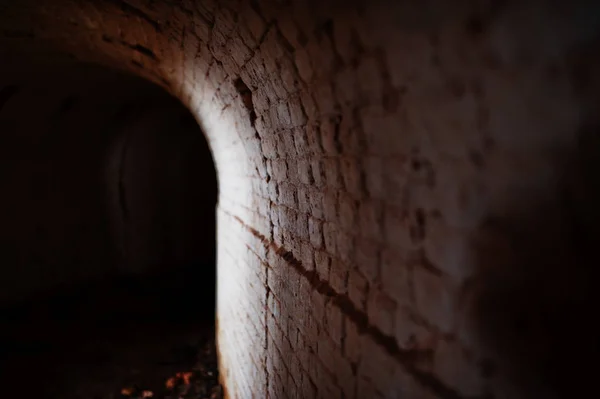 Scary brick arch tunnel on dark and some light. — Stock Photo, Image