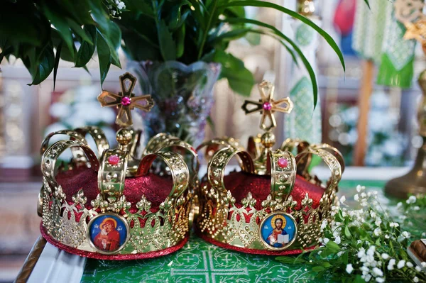 Two golden crowns for wedding ceremony at church. — Stock Photo, Image