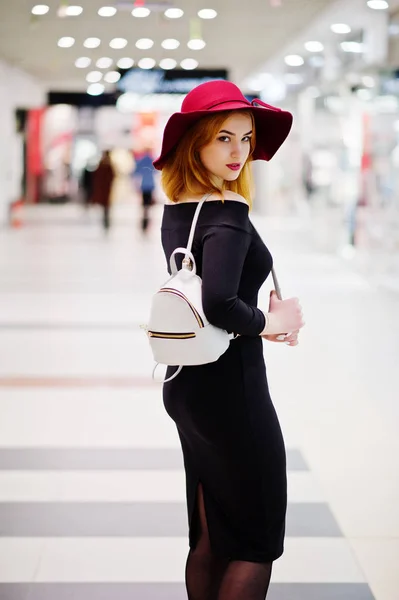 Fashion red haired girl wear on black dress and red hat with lad — Stock Photo, Image