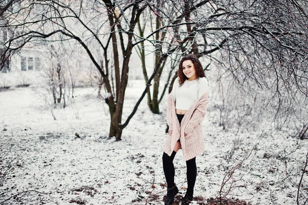 Curly brunette girl background falling snow, wear on warm knitte — Stock Photo, Image