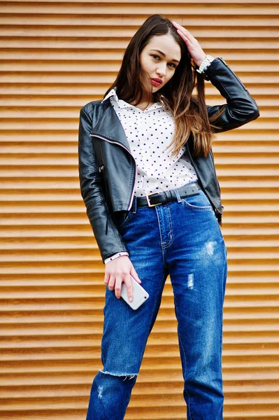 Portrait of stylish young girl wear on leather jacket and ripped — Stock Photo, Image