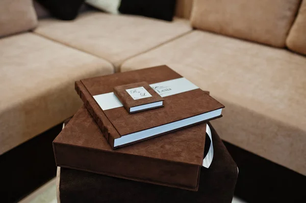 Brown textile wedding book with flash box.