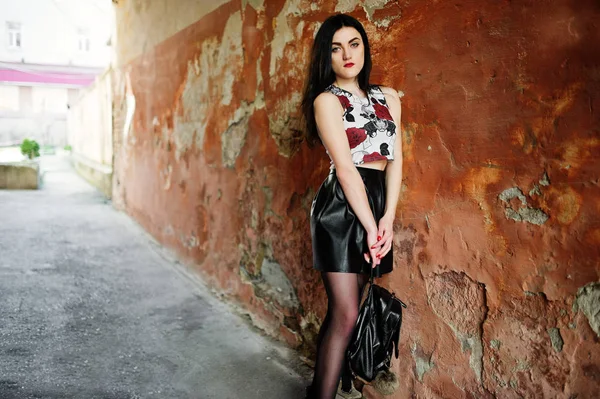 Young goth girl on black leather skirt with backpack posed again — Stock Photo, Image