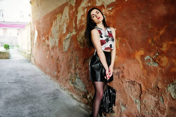 Young goth girl on black leather skirt with backpack posed again — Stock Photo, Image