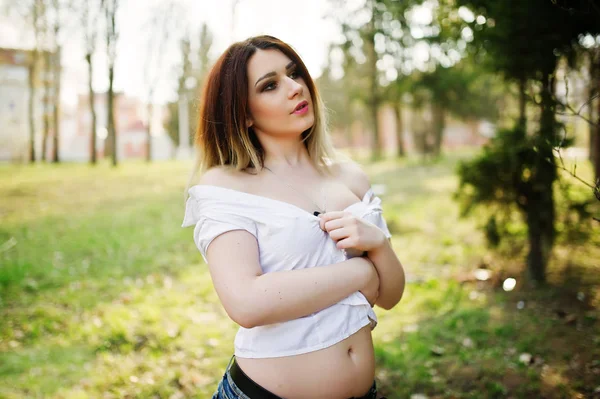 Portrait of girl with streaked hair, wear on white blouse, showi — Stock Photo, Image