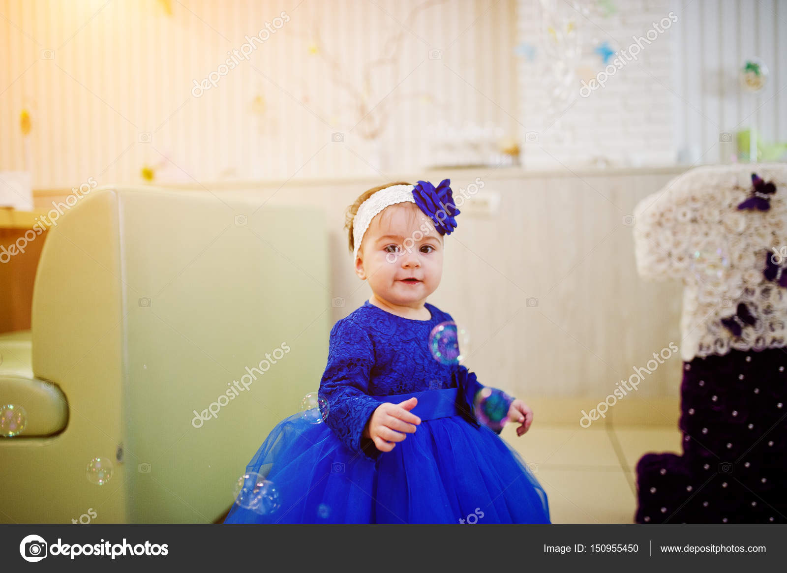 baby girl in blue dress