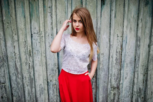 Portrait of beautiful girl with red lips against wooden backgrou — Stock Photo, Image