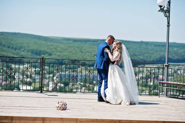 Happy wedding couple in love at observation deck on sunny day. — Stock Photo, Image