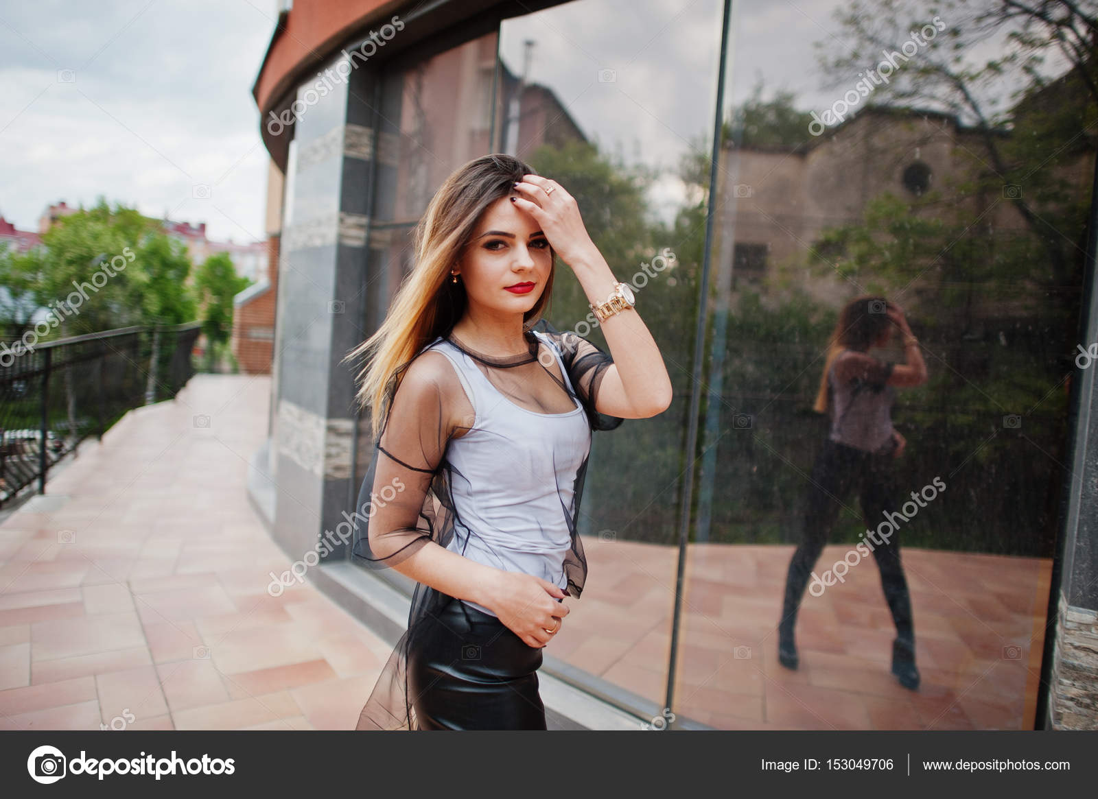 Fashionable woman look at white shirt, black transparent clothes Stock  Photo by ©ASphoto777 153049706